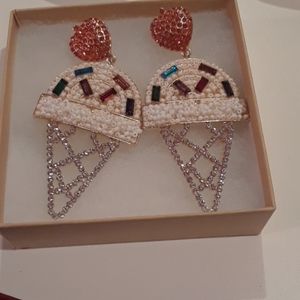 Lipstick and chrome earrings